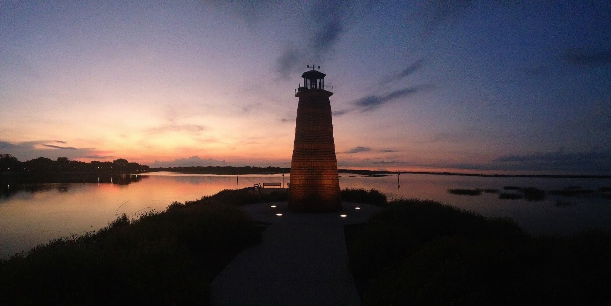 The lighthouse at Lakefront Park on Lake Tohopekaliga at dusk, Kissimmee, Florida