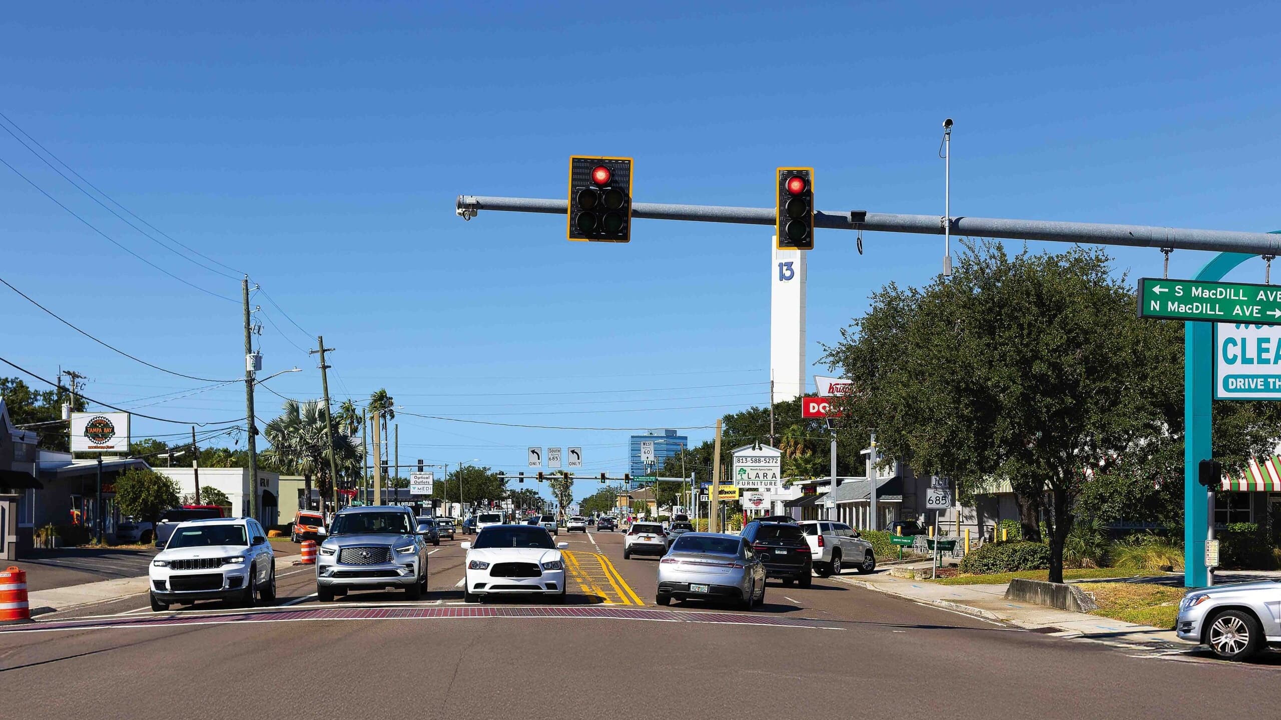 Kennedy Boulevard corridor in Tampa showing the urban streetscape with mid-rise office buildings and downtown towers in the background